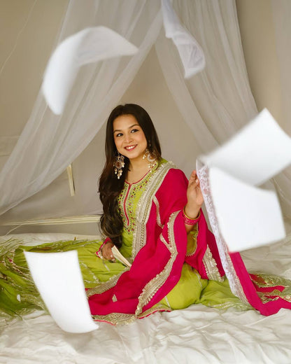 Vibrant lime green traditional outfit with pink and gold accents.