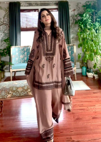 Timeless Sophistication: A Woman in Brown Amidst Luxury Living