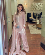 Chic Confidence: Embracing Style and Grace in a Striking Pink Ensemble