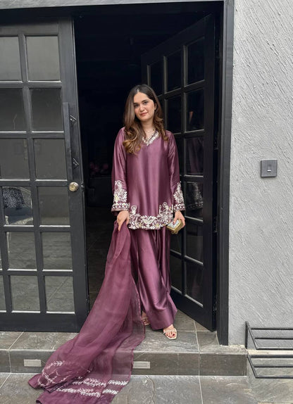 Majestic Aura: Woman in Wine Captivates at the Doorway