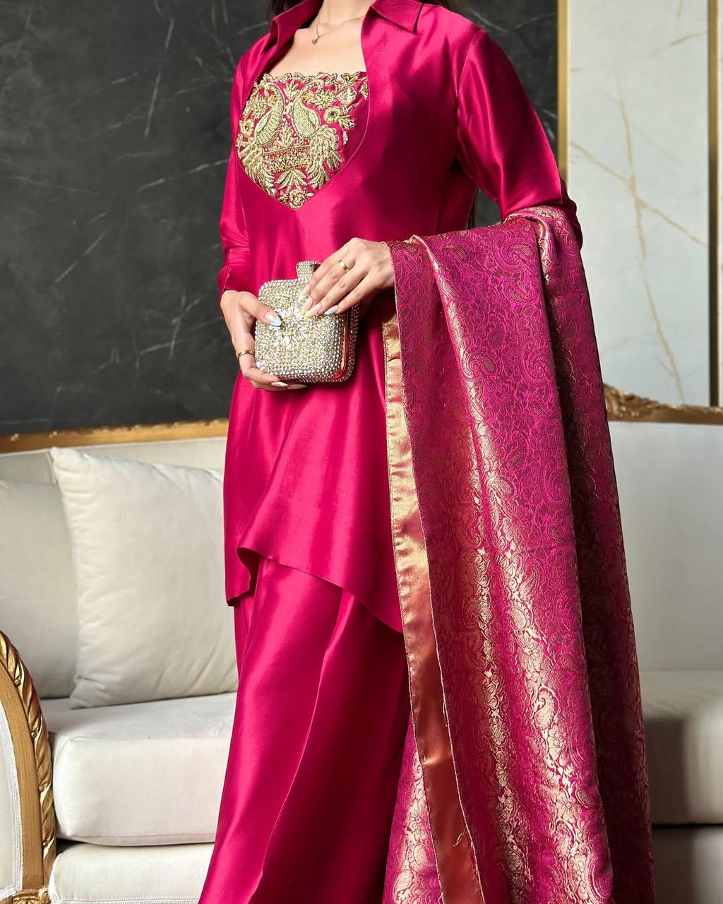 A Vision of Confidence in a Stylish Pink Suit